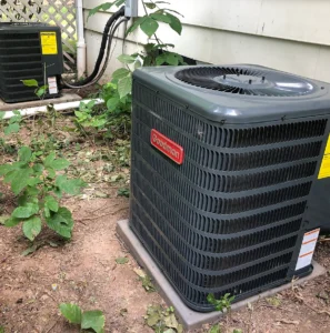 acg LEGACY technician performing AC maintenance on a Moorhead, MN AC unit